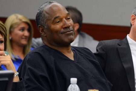  O.J. Simpson (C) and his defense attorneys Patricia Palm (L) and Ozzie Fumo (R) listen during an evidentiary hearing in Clark County District Court on May 17, 2013 in Las Vegas, Nevada. Simpson, who is currently serving a nine-to-33-year sentence in state prison as a result of his October 2008 conviction for armed robbery and kidnapping charges, is using a writ of habeas corpus to seek a new trial, claiming he had such bad representation that his conviction should be reversed.  (Photo by Ethan Miller/Getty Images)