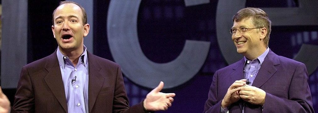 Amazon.com CEO Jeff Bezos (L) tells a joke with Microsoft CEO Bill Gates (R) at the Office XP launch, 31 May, 2001, in New York. (Stan Honda/AFP/Getty Images)