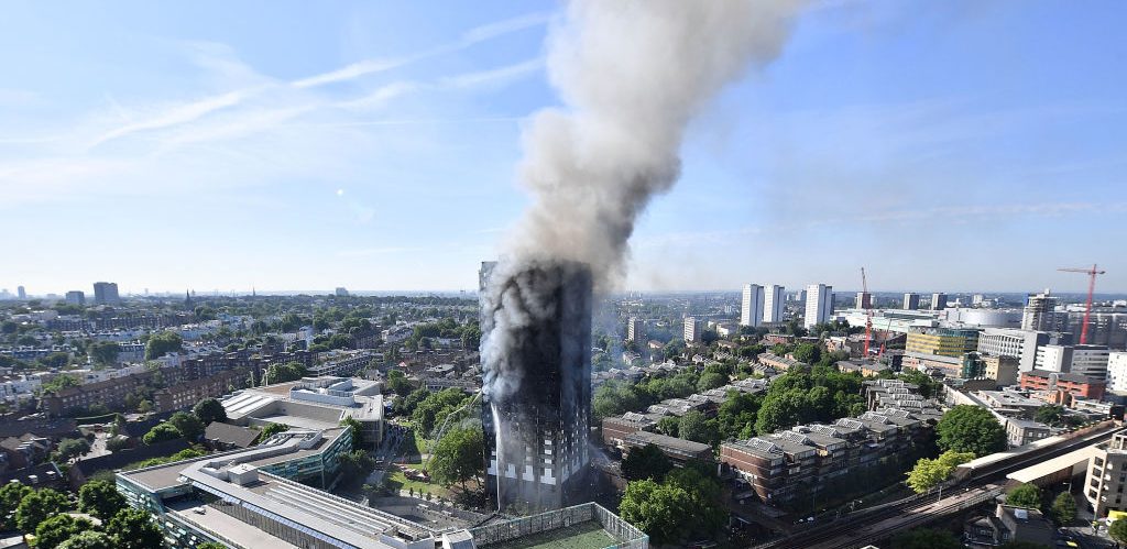 Smoke rises from the building after a huge fire engulfed the 24 story residential Grenfell Tower block in Latimer Road, West London in the early hours of this morning on June 14, 2017 in London, England.
(Photo by Leon Neal/Getty Images)
