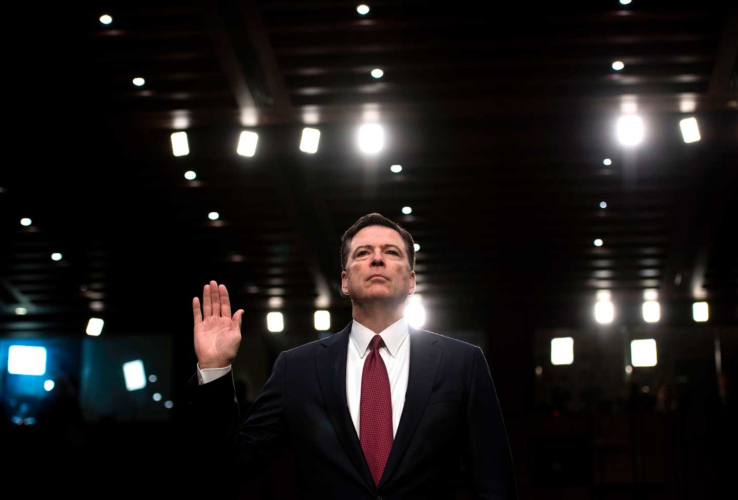 Ousted FBI director James Comey is sworn in during a hearing before the Senate Select Committee on Intelligence on Capitol Hill June 8, 2017 in Washington, DC. Fired FBI director James Comey took the stand Thursday in a crucial Senate hearing, repeating explosive allegations that President Donald Trump badgered him over the highly sensitive investigation Russia's meddling in the 2016 election. (Brendan Smialowski/AFP/Getty Images)