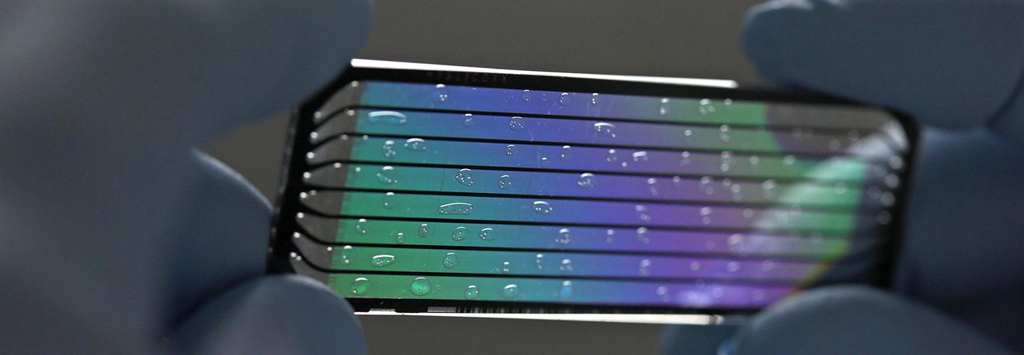 John D'Albora, 41, a senior research technician, holds up a used flow cell to display its intricacies at the Genome Institute at Washington University on Thursday, April 23, 2015. A flow cell holds the DNA for the sequencing machine.