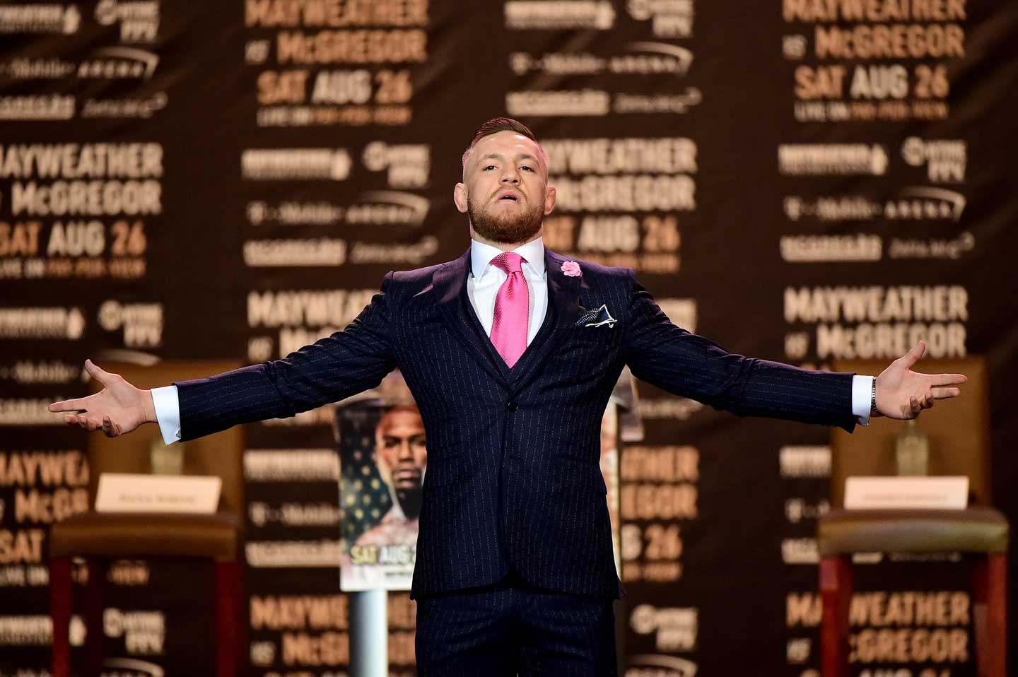 Conor McGregor poses on stage as he is introduced for the Floyd Mayweather Jr. v Conor McGregor World Press Tour at Staples Center on July 11, 2017 in Los Angeles, California. (Harry How/Getty Images)