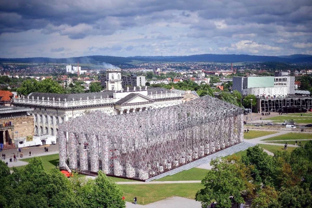 The artwork 'The Parthenon of Books' with donated books by the artist Marta Minujin, the 'Kunsthalle Fridericianum' and the tower 'Zwehrenturm' with the white smoke installation by Daniel Knorr pictured on June 7, 2017 in Kassel, Germany. The documenta 14 is the fourteenth edition of the art exhibition Documenta and will take place 2017 in both Kassel, Germany its traditional home, and Athens, Greece. (Thomas Lohnes/Getty Images)