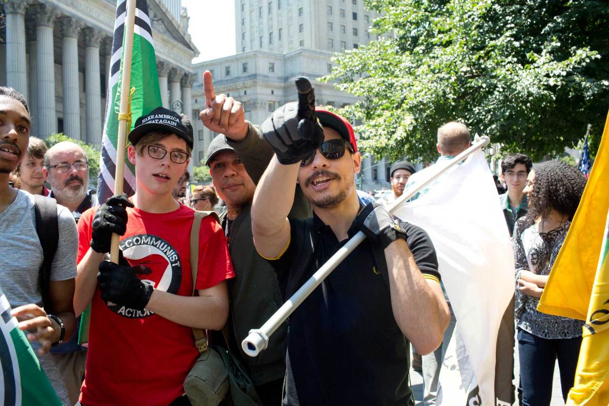 Members of alt-right group like The Proud Boys, seen at right sporting the Fred Perry polo in question, attend a rally to protest sharia law on June 10, 2017 in Foley Square in New York City. (Andrew Lichtenstein/ Corbis via Getty Images)