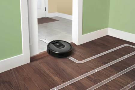 The Roomba might be gathering customer's data in addition to dirt.
(iRobot)