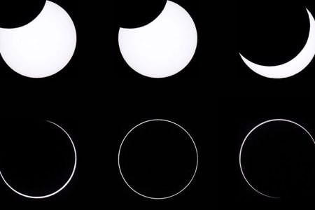 This combination of photos shows an annular solar eclipse, as seen from the Estancia El Muster, near Sarmiento, Chubut province, 1600 kilometres south of Buenos Aires on February 26, 2017.