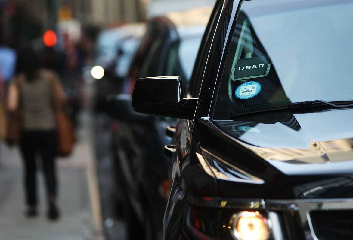  An Uber SUV waits for a client in Manhattan. (Spencer Platt/Getty Images)