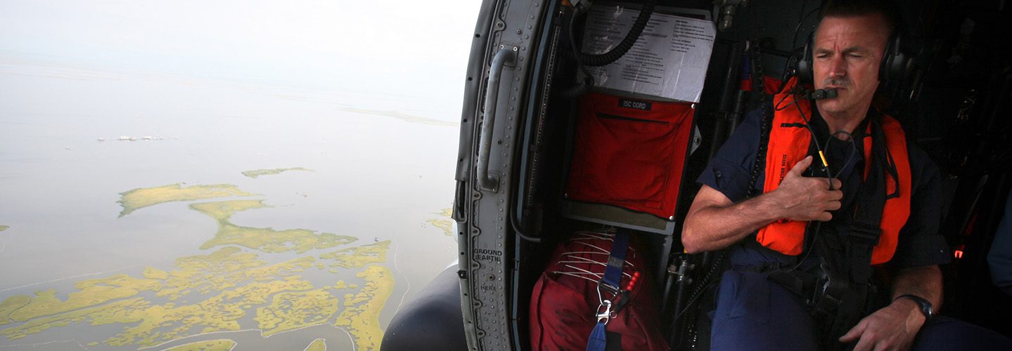 Coast Guard Rear Adm. Paul Zukunft looks out on the oil containment progress in Barataria Bay, Thursday, Aug. 5, 2010 (AP Photo/Kerry Maloney)