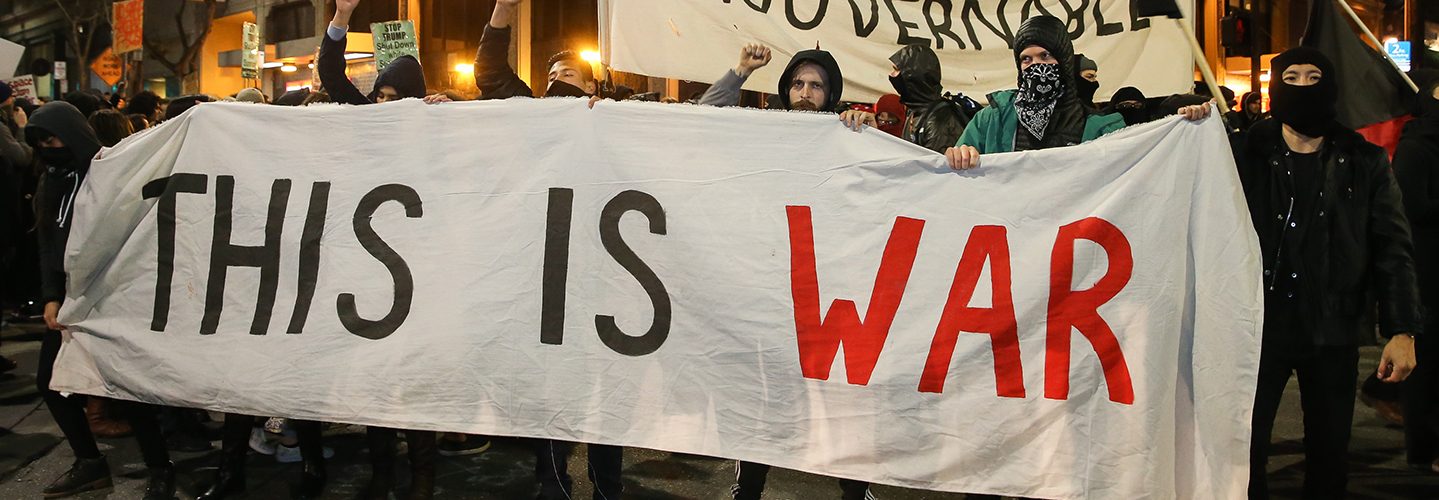 People protesting controversial Breitbart writer Milo Yiannopoulos take to the streets on February 1, 2017 in Berkeley, California.