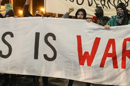 People protesting controversial Breitbart writer Milo Yiannopoulos take to the streets on February 1, 2017 in Berkeley, California.