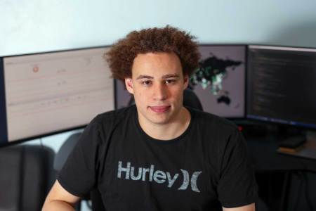 Marcus Hutchins, digital security researcher for Kryptos Logic, poses for a photograph in front of his computer in his bedroom in Ilfracombe, U.K., on Tuesday, July 4, 2017. Hutchins, the 23-year-old who saved the world from a devastating cyberattack in May was asleep in his bed in the English seaside town of Ilfracombe last week after a night of partying when another online extortion campaign spread across the globe. (Chris Ratcliffe/Bloomberg via Getty Images)