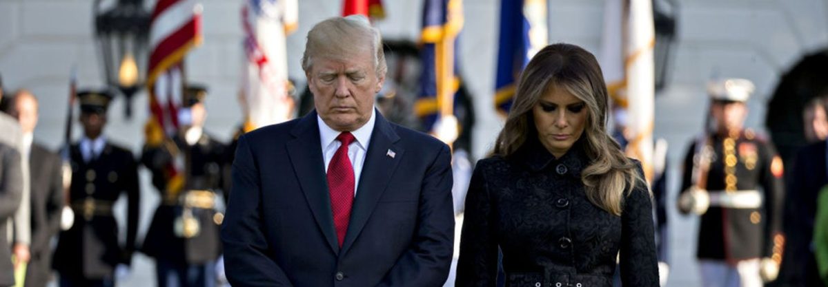 U.S. President Donald Trump and U.S. First Lady Melania Trump lead a moment of silence with White House staff in remembrance of those lost during the September 11, 2001 terrorist attacks, on the South Lawn of the White House in Washington, D.C., U.S., on Monday, Sept. 11, 2017. (Photographer: Andrew Harrer/Bloomberg via Getty Images)