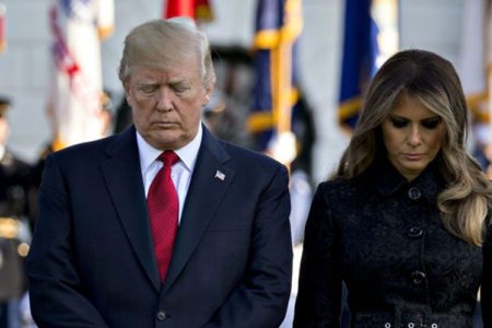 U.S. President Donald Trump and U.S. First Lady Melania Trump lead a moment of silence with White House staff in remembrance of those lost during the September 11, 2001 terrorist attacks, on the South Lawn of the White House in Washington, D.C., U.S., on Monday, Sept. 11, 2017. (Photographer: Andrew Harrer/Bloomberg via Getty Images)