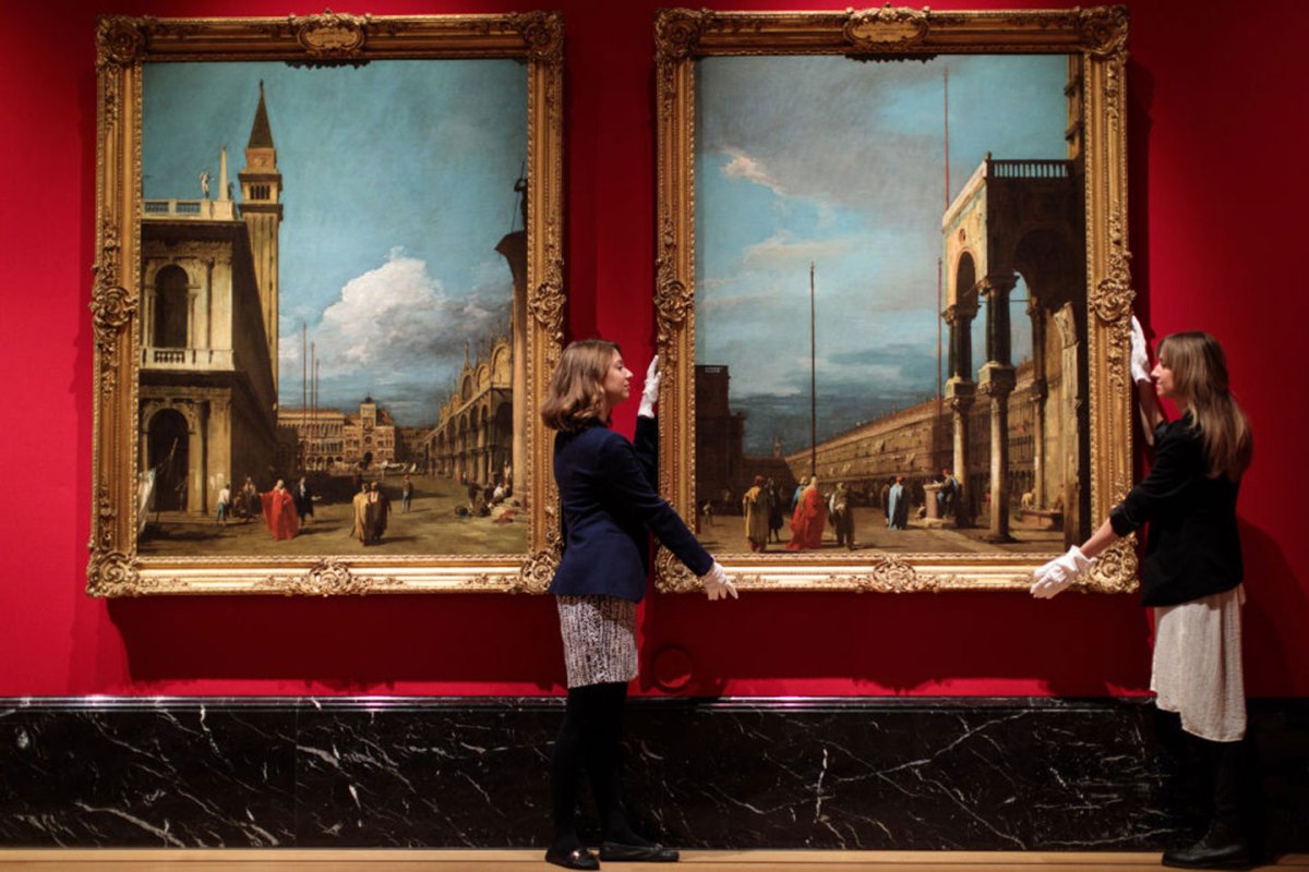 Gallery employees pose with works from Canaletto's views of Venice painted between 1723-1724 at The Queen's Gallery at Buckingham Palace on May 18, 2017 in London, England. A new exhibition at The Queen's Gallery displays Canaletto's views of Venice, produced in the 1720s alongside his series of Roman views from 20 years later. Canaletto & the Art of Venice opens to the public tomorrow, May 19th. (Photo by Jack Taylor/Getty Images)