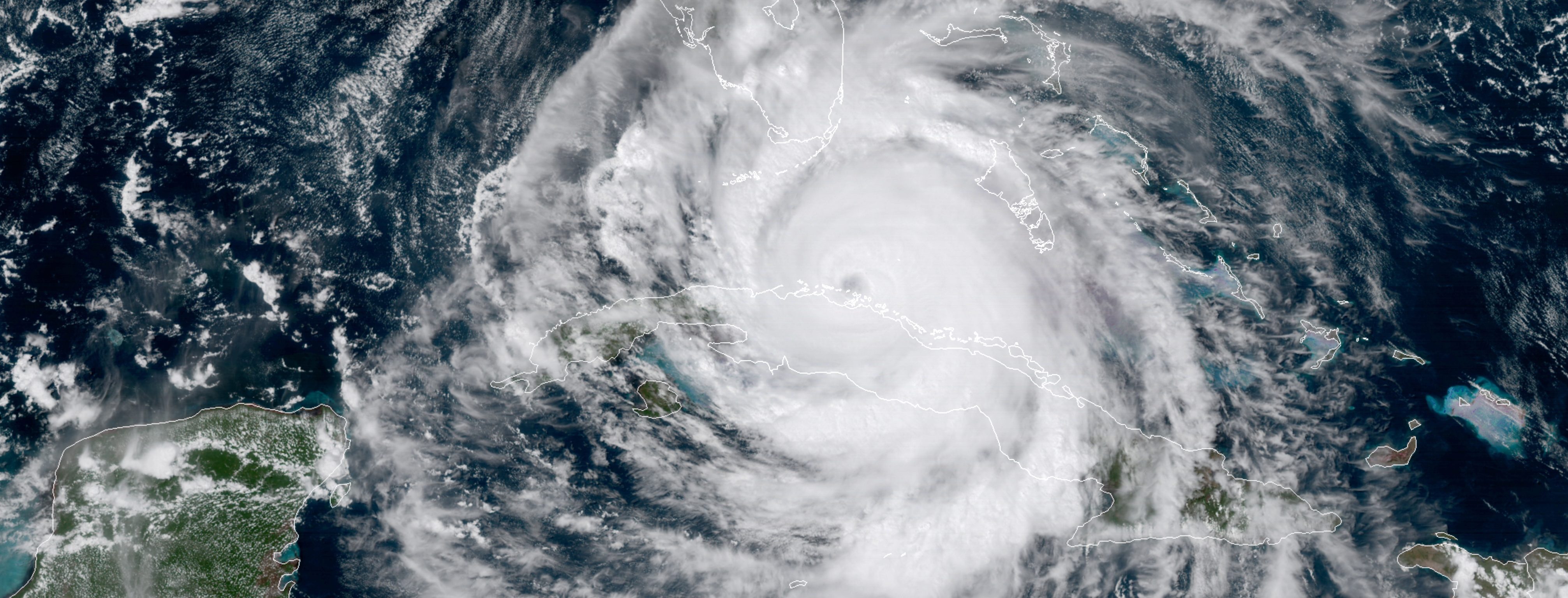 In this satellite image taken Saturday, Sept. 9, 2017, the eye of Hurricane Irma moves northwest just off the coast of Cuba and south of Florida. (NOAA via AP)