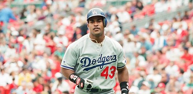Raul Mondesi of the Los Angeles Dodgers looks on against the St. Louis Cardinals at Busch Stadium on May 11, 1996 in St Louis, Missouri. (Photo by Sporting News via Getty Images)