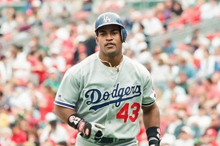 Raul Mondesi of the Los Angeles Dodgers looks on against the St. Louis Cardinals at Busch Stadium on May 11, 1996 in St Louis, Missouri. (Photo by Sporting News via Getty Images)