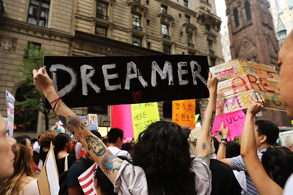 Dozens of immigration advocates and supporters attend a rally outside of  Trump Tower along Fifth Avenue on August 15, 2017 in New York City. The activists were rallying on the five-year anniversary of President Obama's executive order, DACA - Deferred Action for Childhood Arrivals, protecting undocumented immigrants brought to the U.S. as children. Security throughout the area is high with President Donald Trump in residency at the tower, his first visit back to his apartment since his inauguration. Numerous protests and extensive road closures are planned for the area.  (Photo by Spencer Platt/Getty Images)