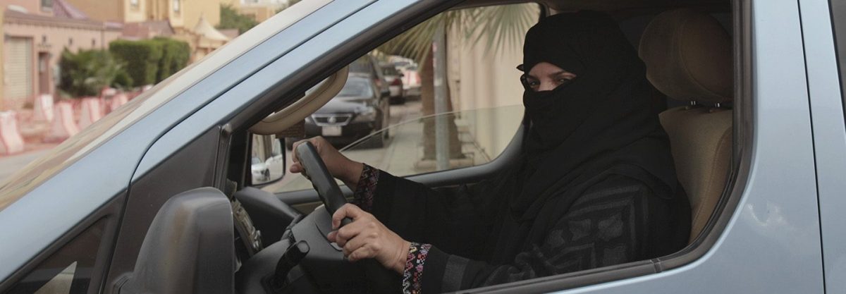 a woman drives a car in Riyadh, Saudi Arabia