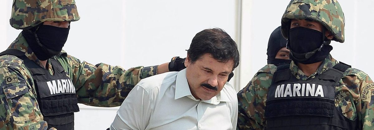Mexican drug trafficker Joaquin Guzman Loera aka 'el Chapo Guzman' (C), is escorted by marines as he is presented to the press on February 22, 2014 in Mexico City. The Sinaloa cartel leader - the most wanted by US and Mexican anti-drug agencies - was arrested early this morning by Mexican marines at a resort in Mazatlan, northern Mexico. AFP PHOTO/Alfredo Estrella (Getty Images)