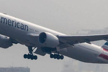 A Boeing 777 passenger plane belonging to the American Airlines flies into the clouds after lifting off from Hong Kong International Airport, on 23 October 2017, in Hong Kong, Hong Kong. (Photo by studioEAST/Getty Images)