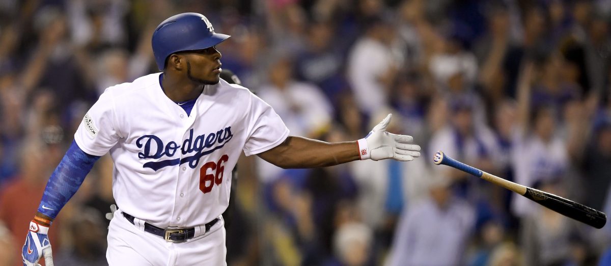Los Angeles Dodgers' Yasiel Puig watches his home run against the Chicago Cubs during the seventh inning of Game 1 of baseball's National League Championship Series in Los Angeles, Saturday, Oct. 14, 2017. (AP Photo/Mark J. Terrill)