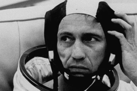Astronaut Donn F. Eisele sitting back in full attached uniform while adjusting the left side of his head gear. (Photo by Time Life Pictures/NASA/The LIFE Picture Collection/Getty Images)