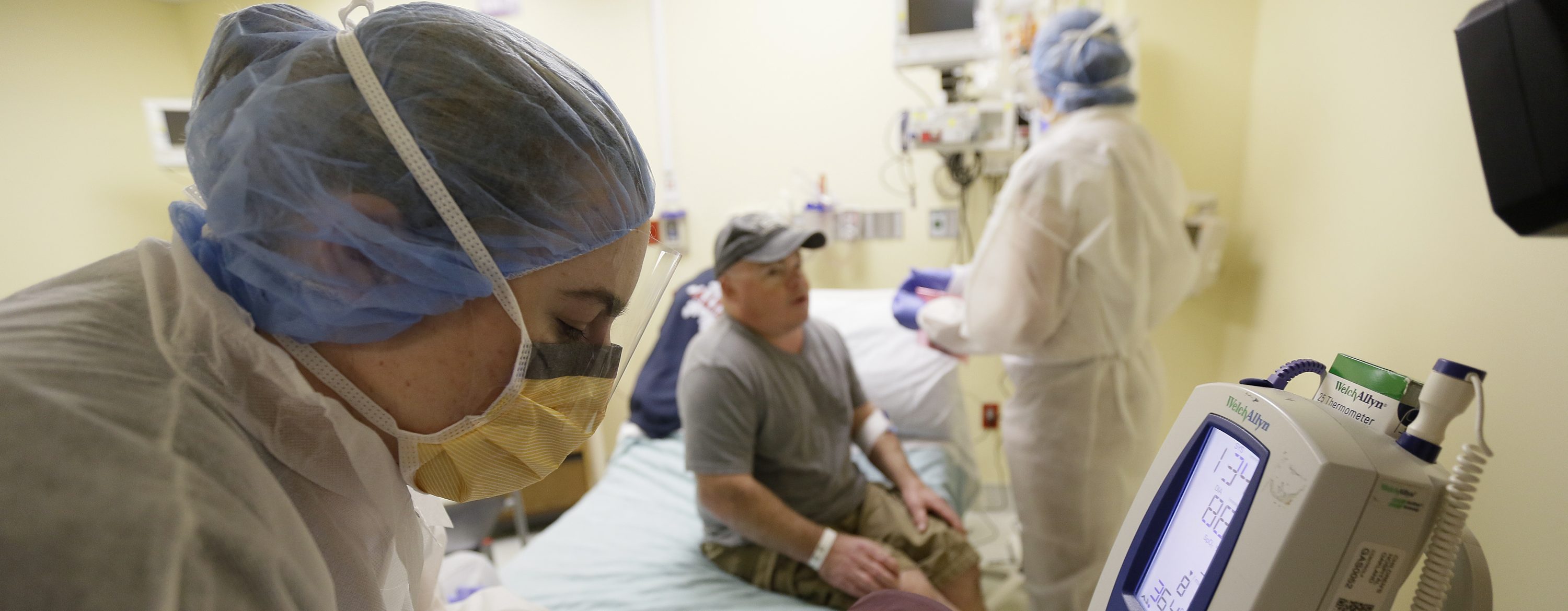 In this photo taken Monday, Nov. 13, 2017, Brian Madeux, 44, has his vitals checked before receiving the first human gene editing therapy for Hunter syndrome, at the UCSF Benioff Children's Hospital in Oakland, Calif. (AP Photo/Eric Risberg)