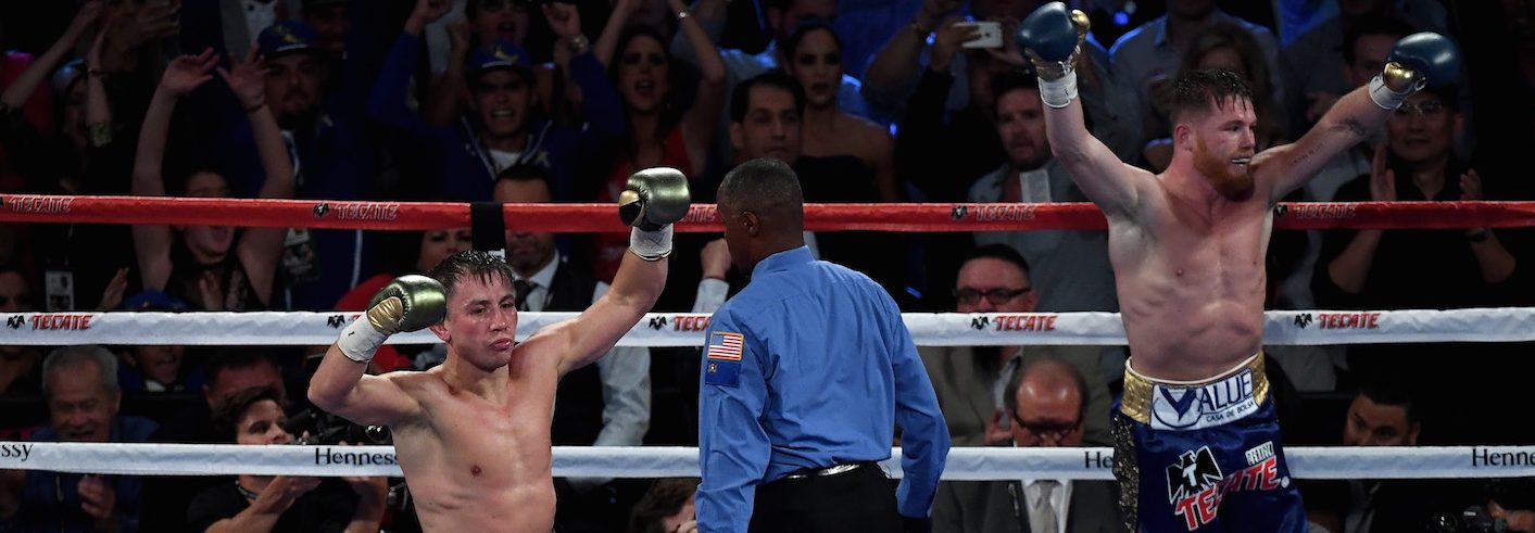 (L-R) "GGG" Gennady Golovkin and "Canelo" Alvarez both celebrate after the final round in their middleweight championship bout on September 16, 2017 in Las Vegas, Nevada. (Ethan Miller/Getty Images)