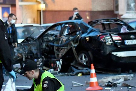 Police experts examines a crime scene after a car blast in the center of Ukrainian capital of Kiev on September 8, 2017.
(SERGEI SUPINSKY/AFP/Getty Images)