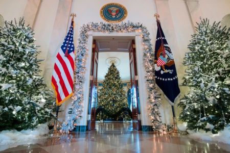 Christmas trees are seen during a preview of holiday decorations in the Grand Foyer of the White House in Washington, DC, November 27, 2017. / AFP PHOTO / SAUL LOEB        (Photo credit should read SAUL LOEB/AFP/Getty Images)