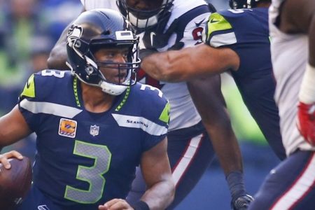 Quarterback Russell Wilson #3 of the Seattle Seahawks escapes to go on a 21 yard run against the Houston Texans during the fourth quarter of the game at CenturyLink Field on October 29, 2017 in Seattle, Washington. (Photo by Jonathan Ferrey/Getty Images)