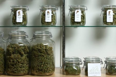 Jars of medical cannabis line the shelves inside a Good Meds medical cannabis center.
(Photo by Matthew Staver/For The Washington Post via Getty Images)