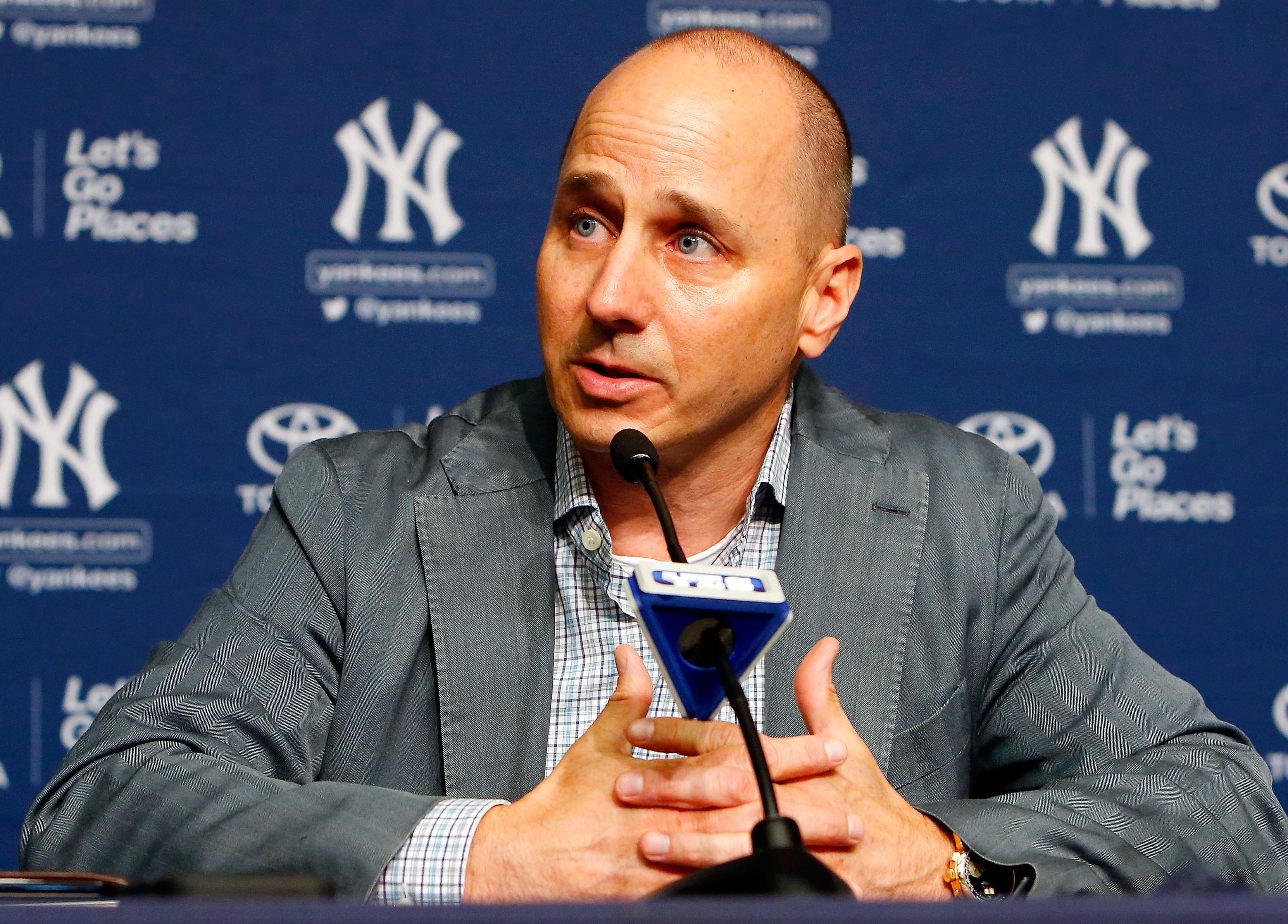 New York Yankees general manager Brian Cashman speaks during a news conference on August 7, 2016 at Yankee Stadium in the Bronx borough of New York City.  (Photo by Jim McIsaac/Getty Images)