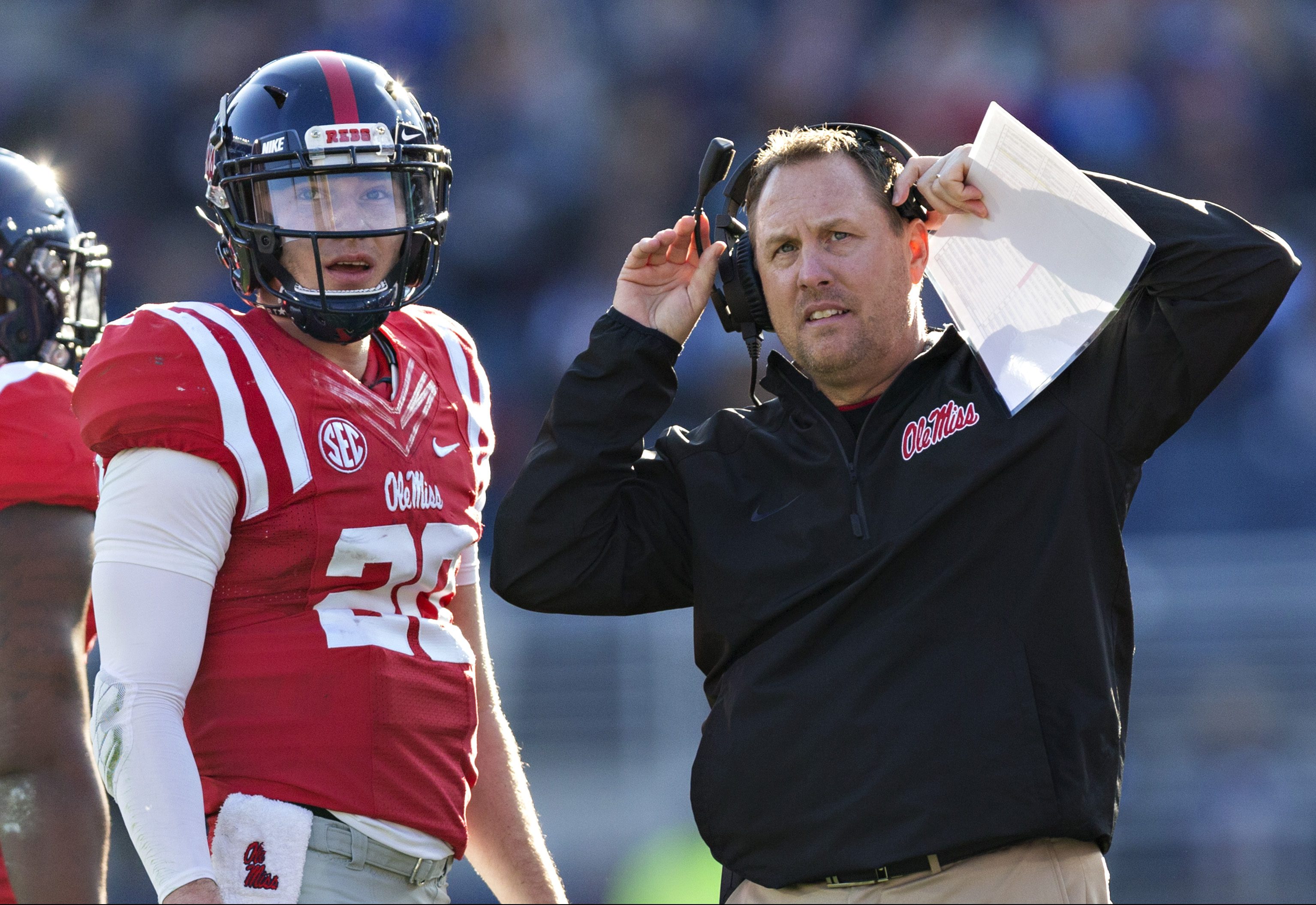 Head Coach Hugh Freeze talks with Shea Patterson #20 of the Mississippi Rebels during a game against the Mississippi State Bulldogs at Vaught-Hemingway Stadium on November 26, 2016 in Oxford, Mississippi. (Wesley Hitt/Getty Images)