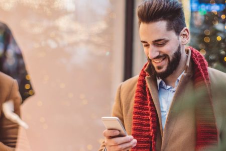 Man using his smart phone to shop in Vienna, Austria. (Getty)
