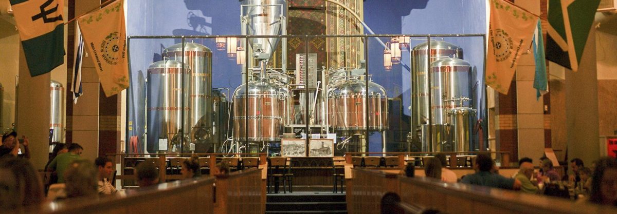 Beer brewing tanks sit at the former altar of The Church Brew Works, an old church renovated into a brewery, in Pittsburgh.  (AP Photo/Dake Kang)