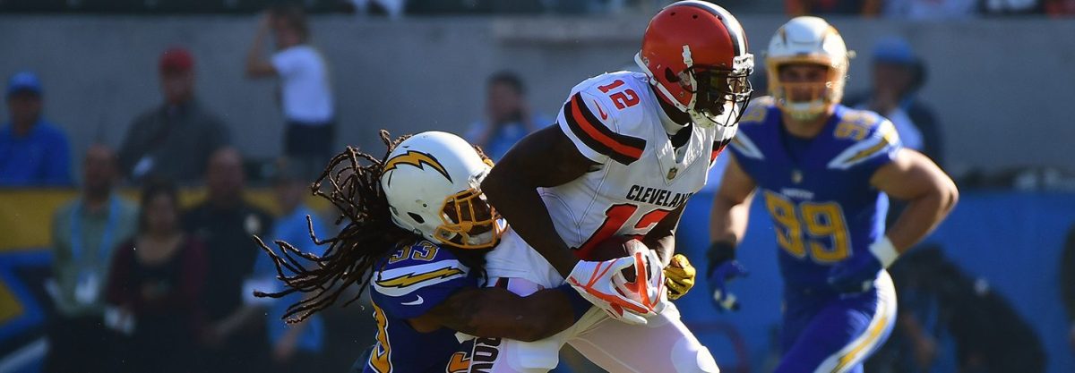 Tre Boston #33 of the Los Angeles Chargers tackles Josh Gordon #12 of the Cleveland Browns during the first quarter of the game. (Harry How/Getty Images)