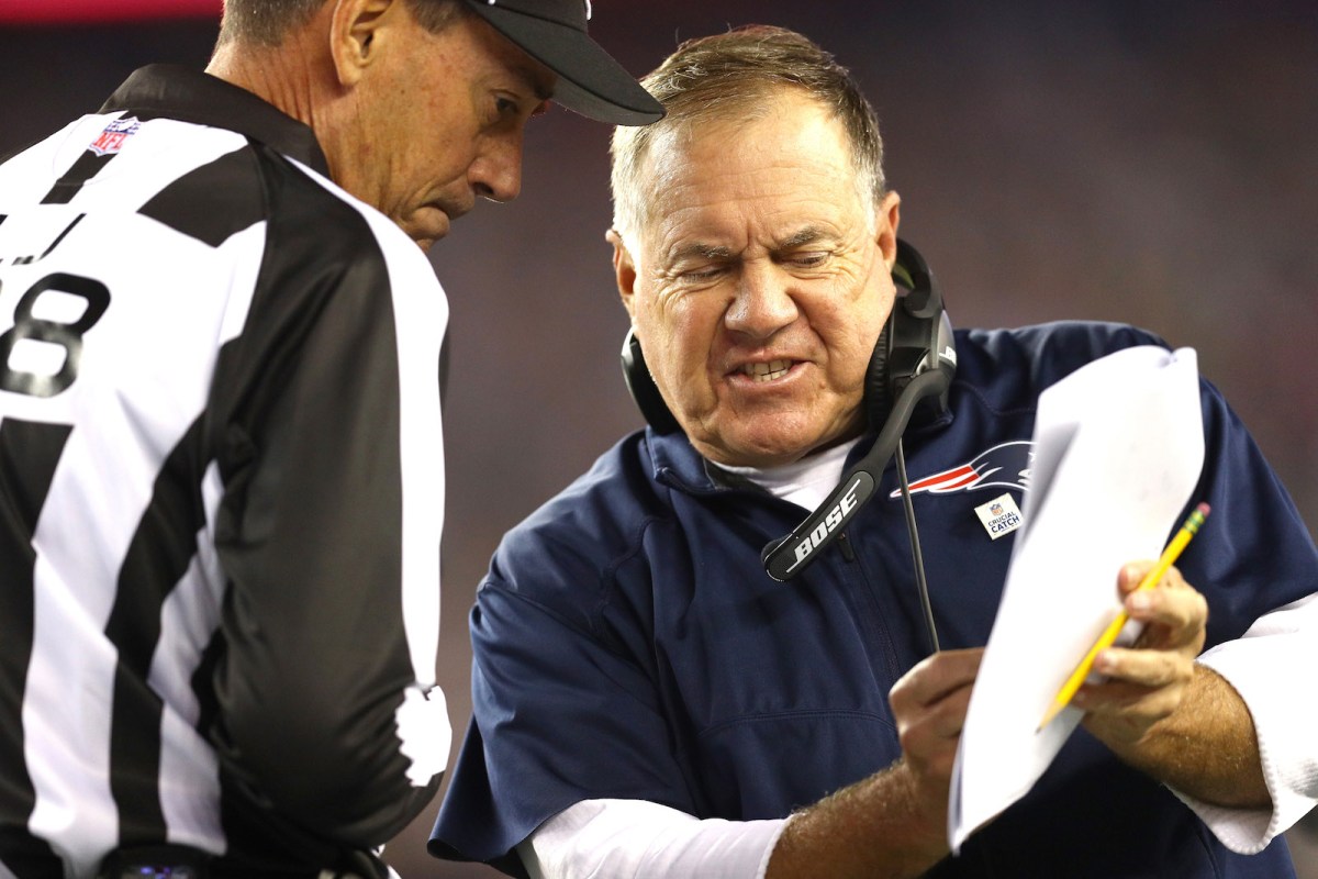 NFL head coach Bill Belichick of the New England Patriots speaks with a referee during a game against the Atlanta Falcons at Gillette Stadium on October 22, 2017. (Maddie Meyer/Getty Images)
