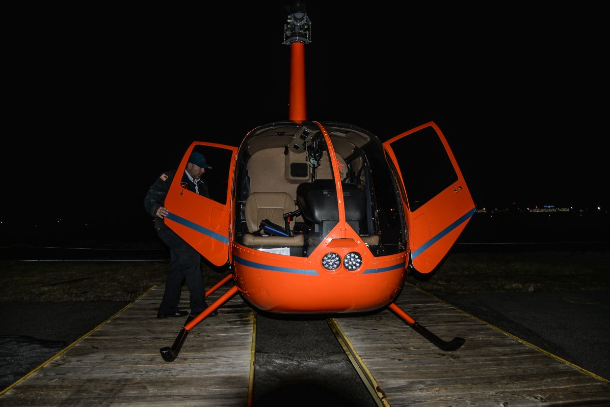 Anthony Ianni readies the WingsAir "Pumpkin" helicopter for flight. (Diana Crandall)