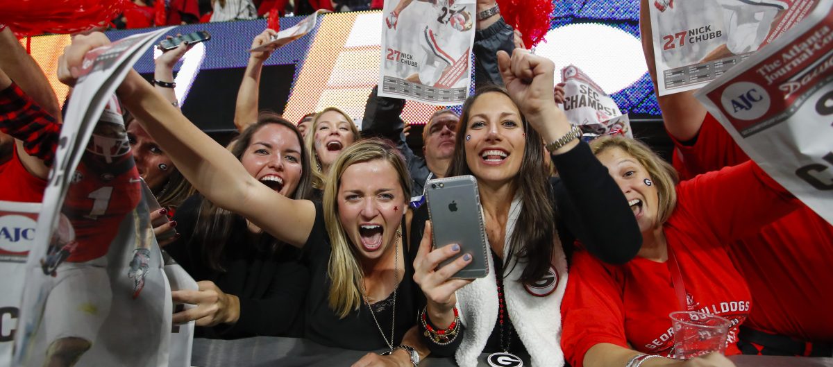 Georgia Bulldogs fans reacts with a paper saying SEC Champs in the final seconds of the SEC Championship Game between the Georgia Bulldogs and the Auburn Tigers on December 02, 2017 at Mercedes-Benz Stadium in Atlanta, GA. (Photo by Todd Kirkland/Icon Sportswire via Getty Images)