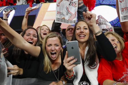 Georgia Bulldogs fans reacts with a paper saying SEC Champs in the final seconds of the SEC Championship Game between the Georgia Bulldogs and the Auburn Tigers on December 02, 2017 at Mercedes-Benz Stadium in Atlanta, GA. (Photo by Todd Kirkland/Icon Sportswire via Getty Images)
