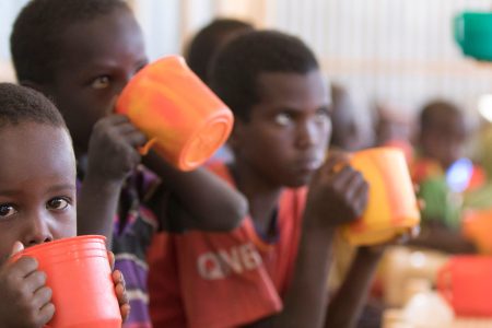 Young children drink a high protein mix provided by the World Food Programme (WFP) during a school feeding programme at Mekladida refugee camp in the Somali region of Ethiopia on December 19, 2017.
(ZACHARIAS ABUBEKER/AFP/Getty Images)