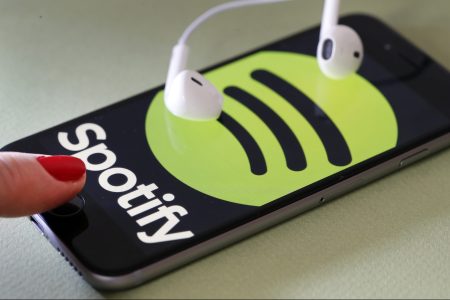 In this photo illustration, the logo of the Swedish music streaming service Spotify is displayed on the screen of an iPhone on January 06, 2017 in Paris, France. (Photo by Chesnot/Getty Images)