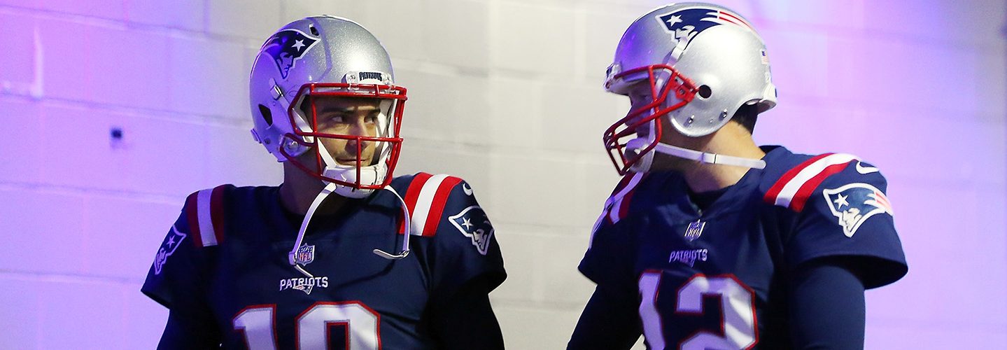 Tom Brady #12 and Jimmy Garoppolo #10 of the New England Patriots