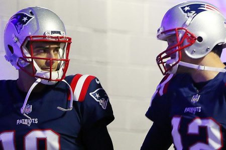 Tom Brady #12 and Jimmy Garoppolo #10 of the New England Patriots