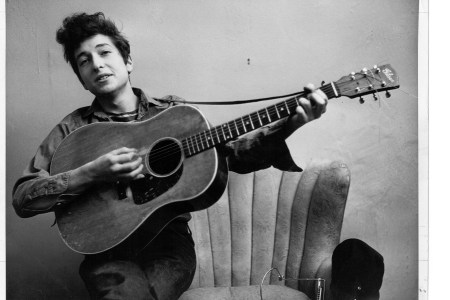 Bob Dylan poses for a portrait with his Gibson Acoustic guitar in September 1961 in New York City, New York. (Photo by Michael Ochs Archives/Getty Images)