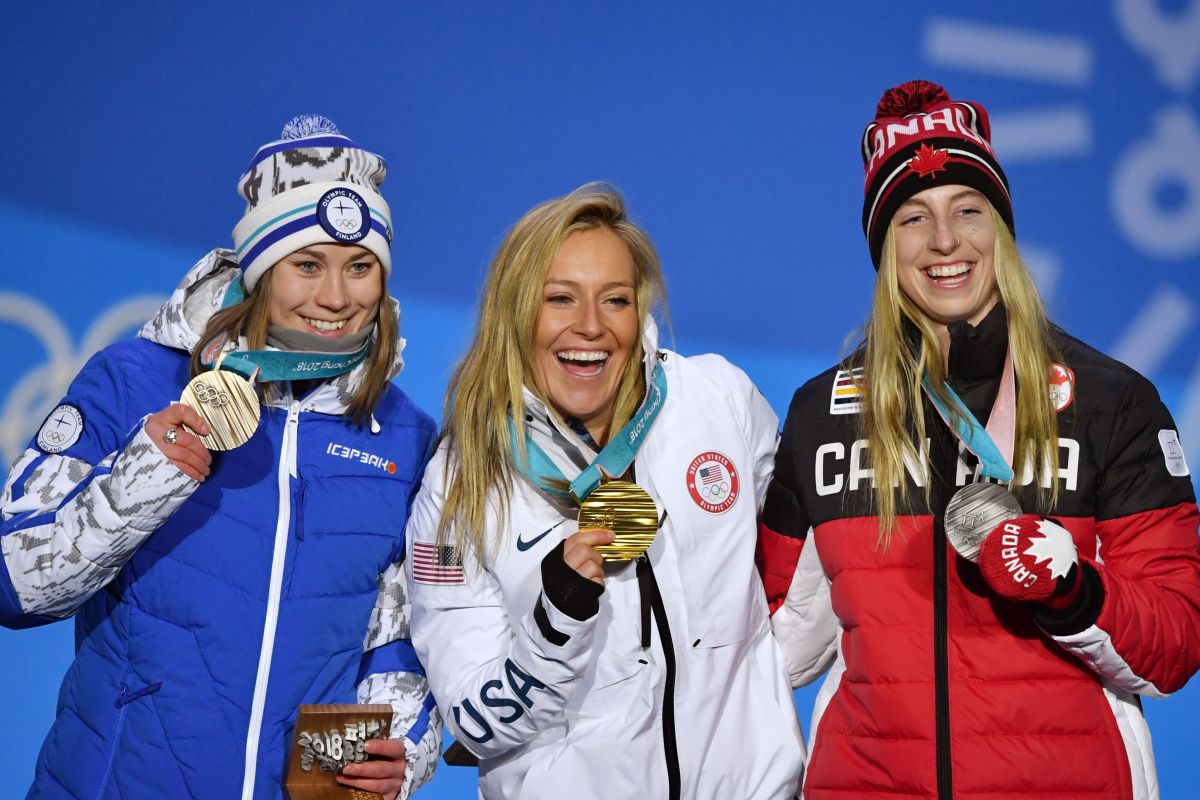 (L-R) Finland's bronze medallist Enni Rukajarvi, USA's gold medallist Jamie Anderson and Canada's silver medallist Laurie Blouin pose on the podium during the medal ceremony for the women's snowboard slopestyle at the Pyeongchang Medals Plaza during the Pyeongchang 2018 Winter Olympic Games in Pyeongchang on February 12, 2018. / AFP PHOTO / Fabrice COFFRINI        (Photo credit should read FABRICE COFFRINI/AFP/Getty Images)