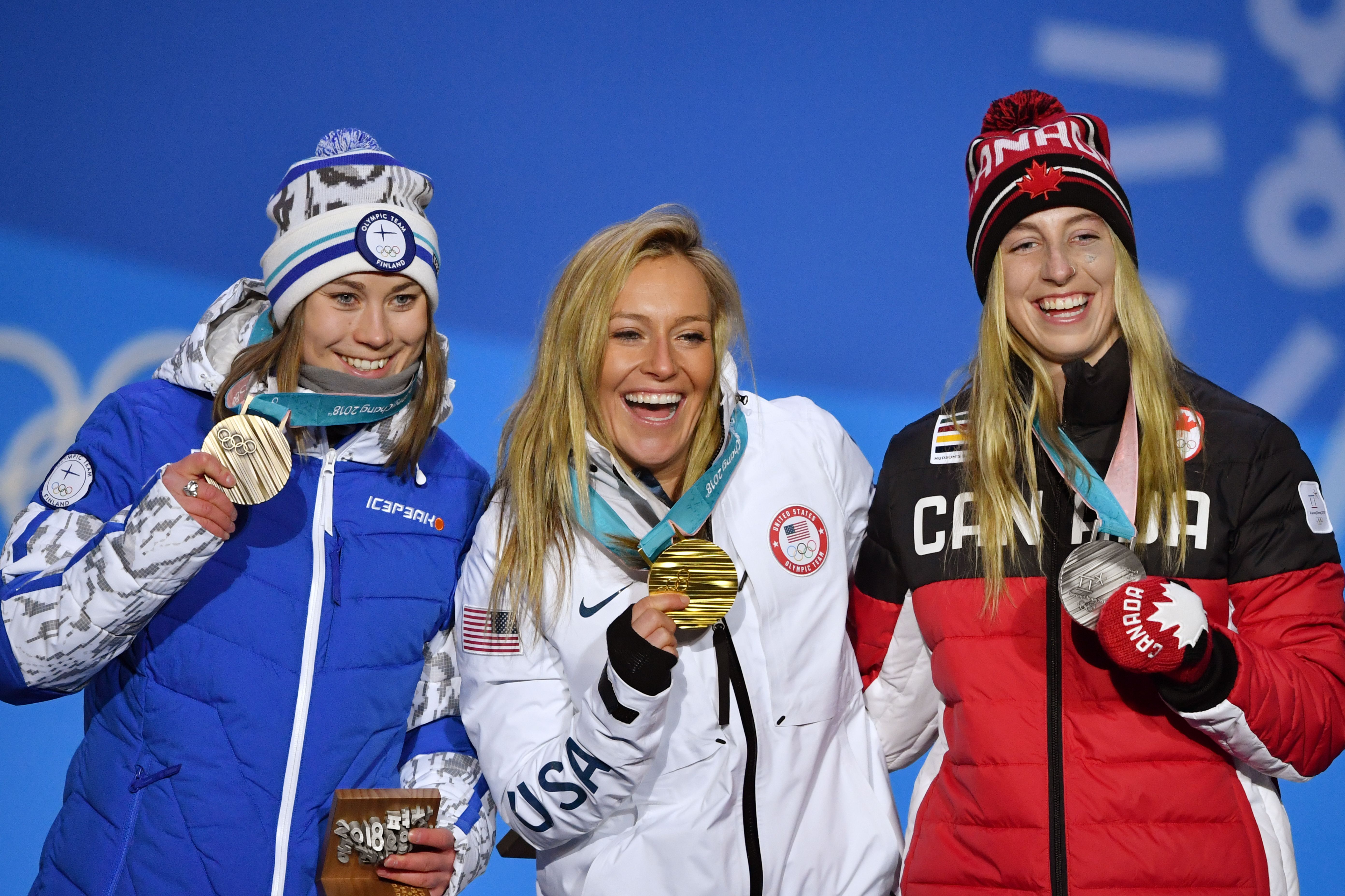(L-R) Finland's bronze medallist Enni Rukajarvi, USA's gold medallist Jamie Anderson and Canada's silver medallist Laurie Blouin pose on the podium during the medal ceremony for the women's snowboard slopestyle at the Pyeongchang Medals Plaza during the Pyeongchang 2018 Winter Olympic Games in Pyeongchang on February 12, 2018. / AFP PHOTO / Fabrice COFFRINI        (Photo credit should read FABRICE COFFRINI/AFP/Getty Images)