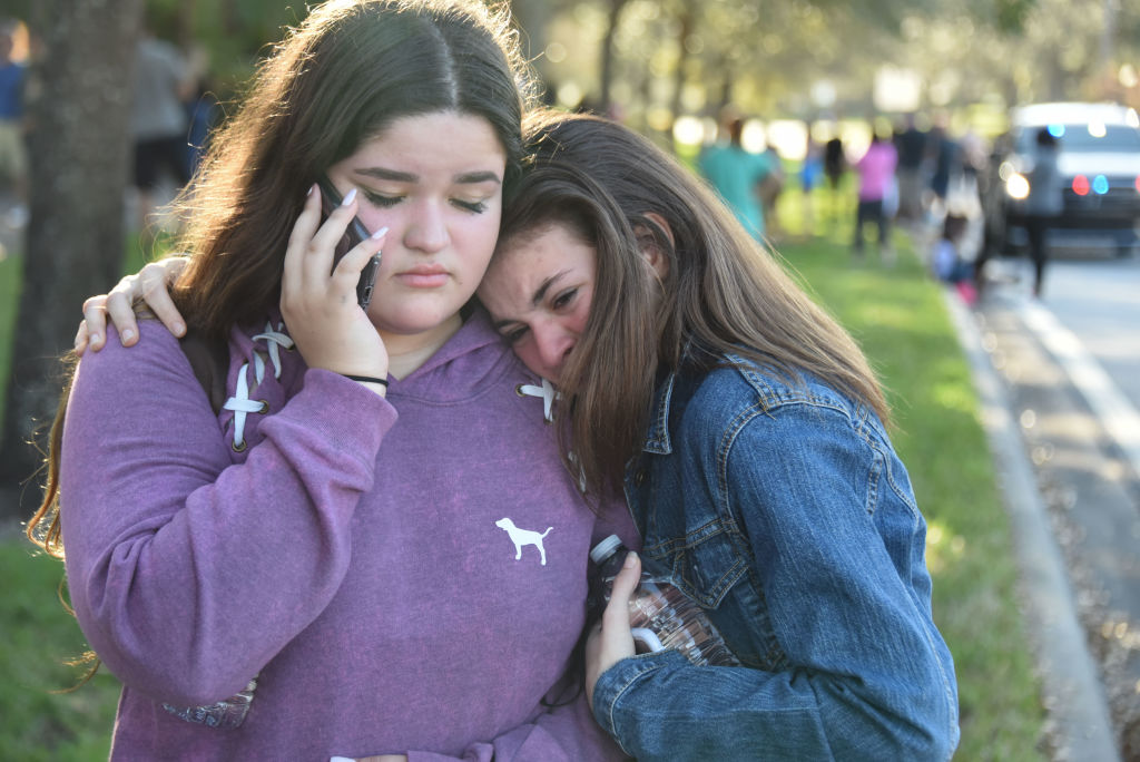 Students react following a shooting at Marjory Stoneman Douglas High School in Parkland, Florida, a city about 50 miles (80 kilometers) north of Miami on February 14, 2018. (Michele Eve Sandberg/AFP/Getty)